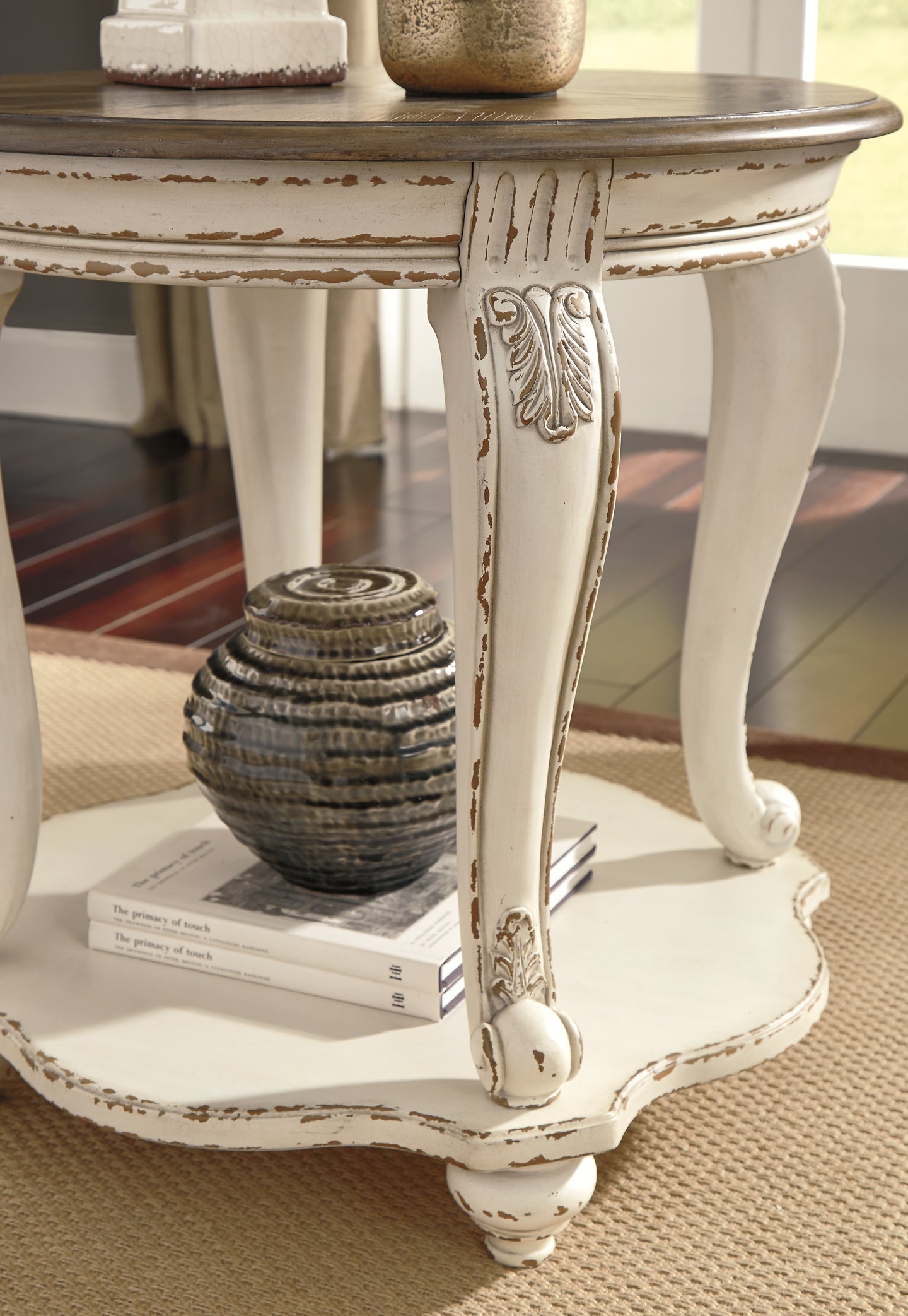 Realyn Round End Table Signature Design by Ashley®