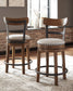 Valebeck Counter Height Dining Table and 4 Barstools Signature Design by Ashley®