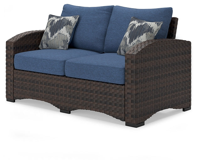 Windglow Outdoor Loveseat and 2 Chairs with Coffee Table Signature Design by Ashley®