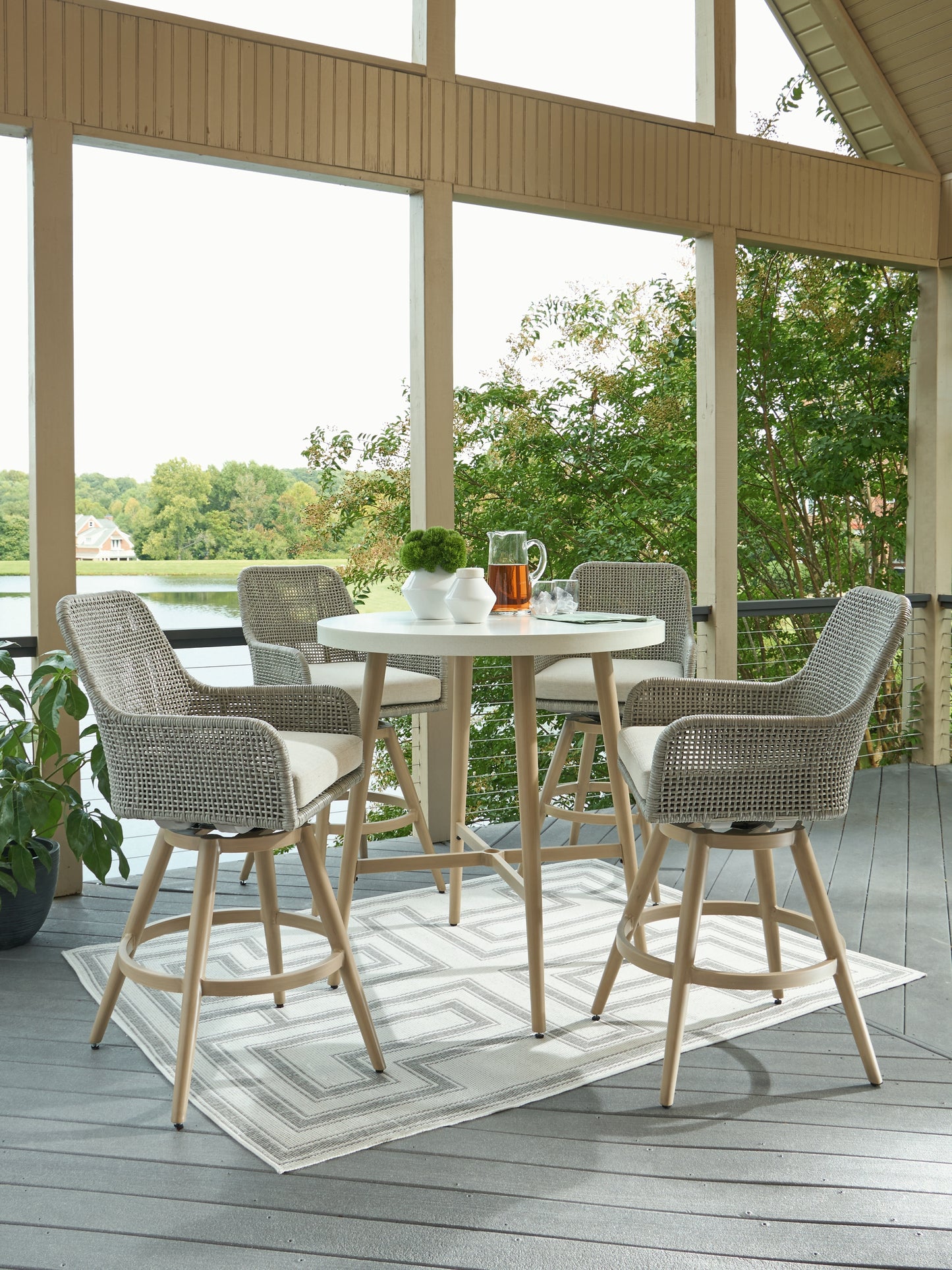 Seton Creek Outdoor Bar Table and 4 Barstools Signature Design by Ashley®