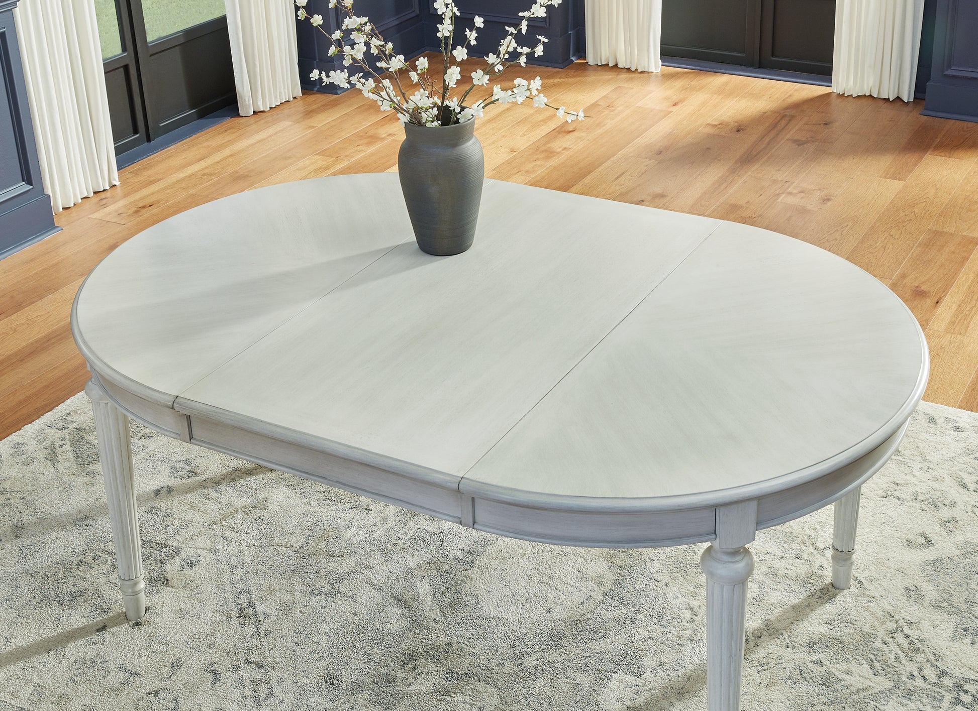 Montelaine Oval Dining Room EXT Table Benchcraft®