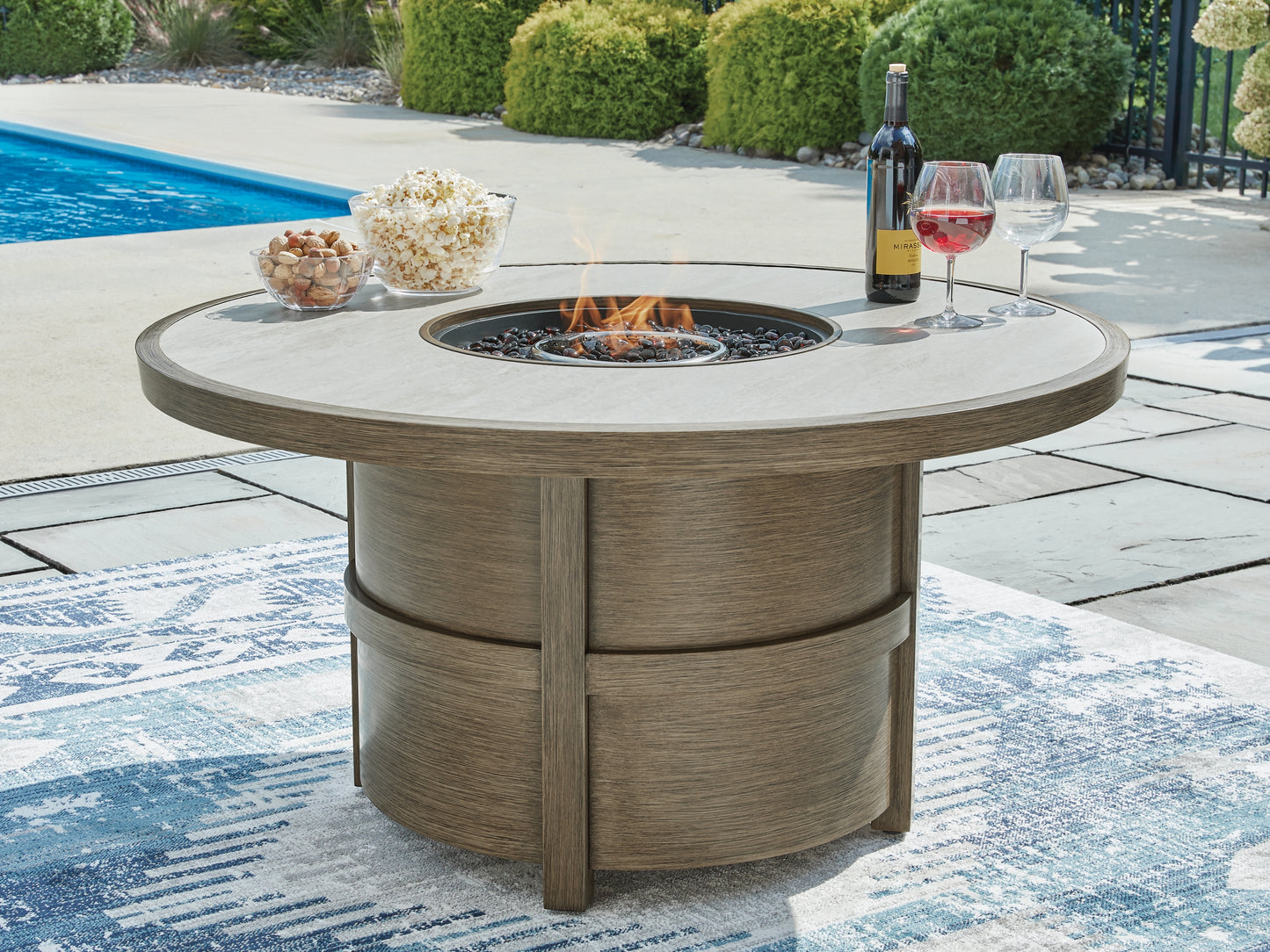 Rainier Ranch Round Fire Pit Table Signature Design by Ashley®