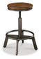 Torjin Counter Height Dining Table and 4 Barstools Signature Design by Ashley®