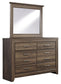 Juararo California King Poster Bed with Mirrored Dresser and Chest Signature Design by Ashley®