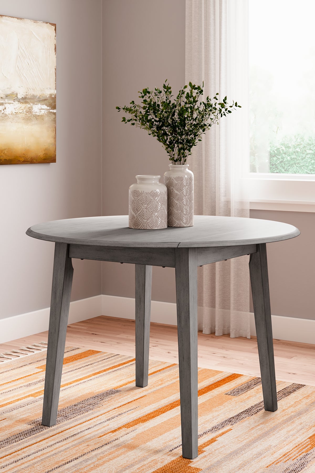 Shullden Round DRM Drop Leaf Table Signature Design by Ashley®