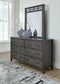 Montillan King Panel Bed with Mirrored Dresser and 2 Nightstands Signature Design by Ashley®